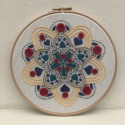 Mandala varia (kit example) rainbow finished embroidery hoop